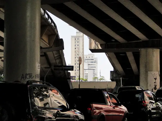 This image is clicked at the bottom side of a flyover and I can see pillars of the flyover and I...