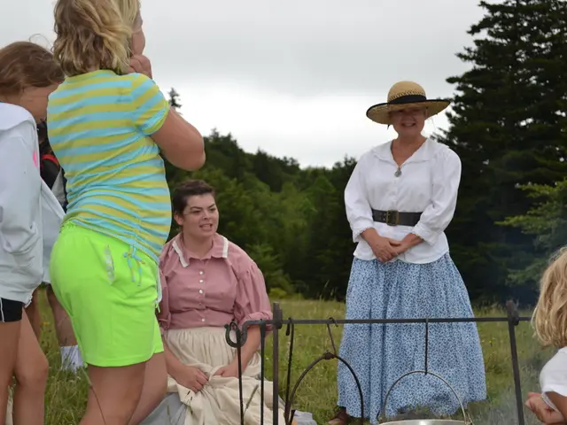 In the image there are few kids and women standing on the grassland, in the background there are...