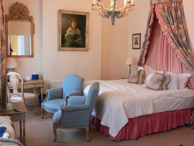 This image is an inside view of a bedroom, in this image we can see the bed and pillows on top of...
